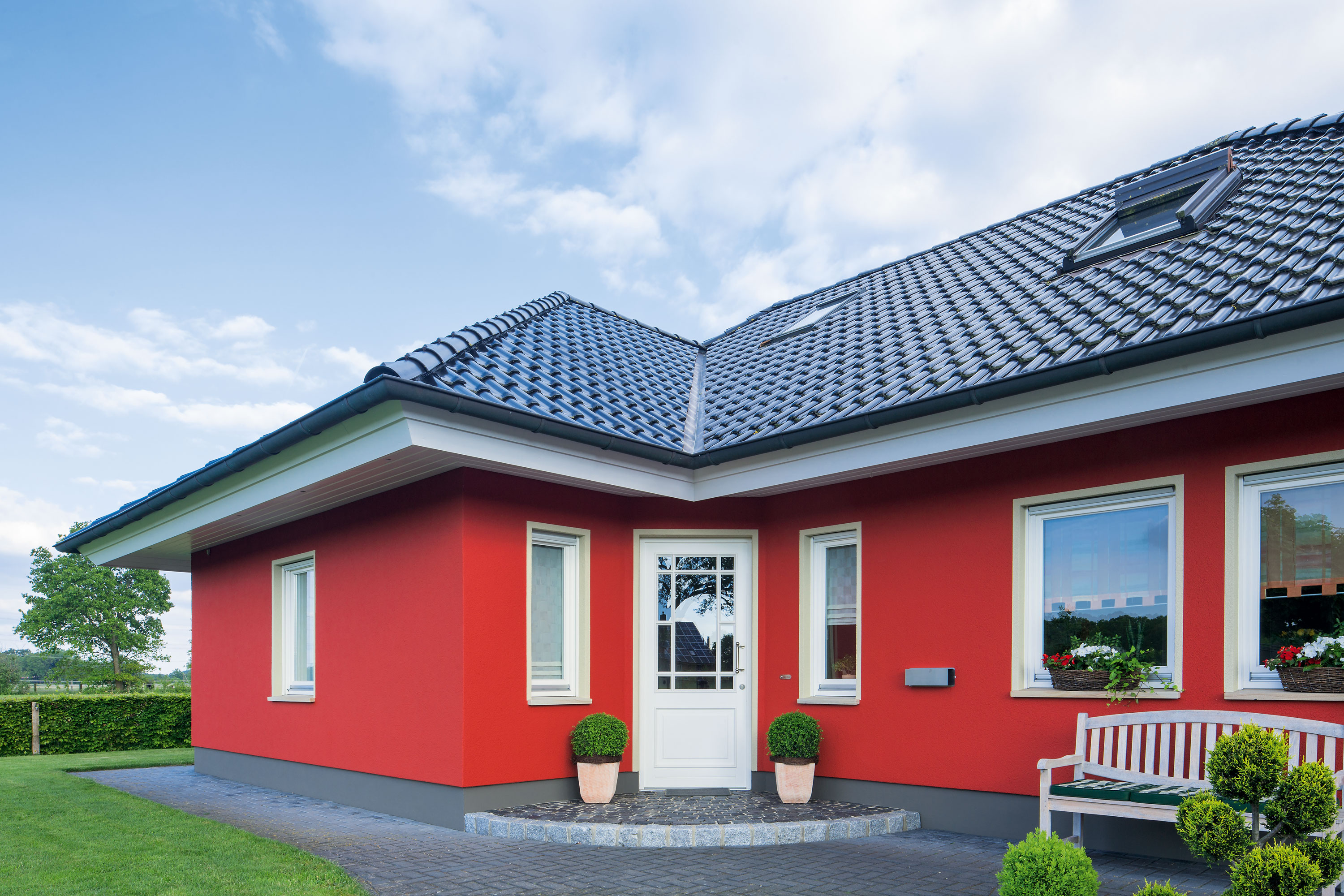 Einfamilienhaus rote Fassade